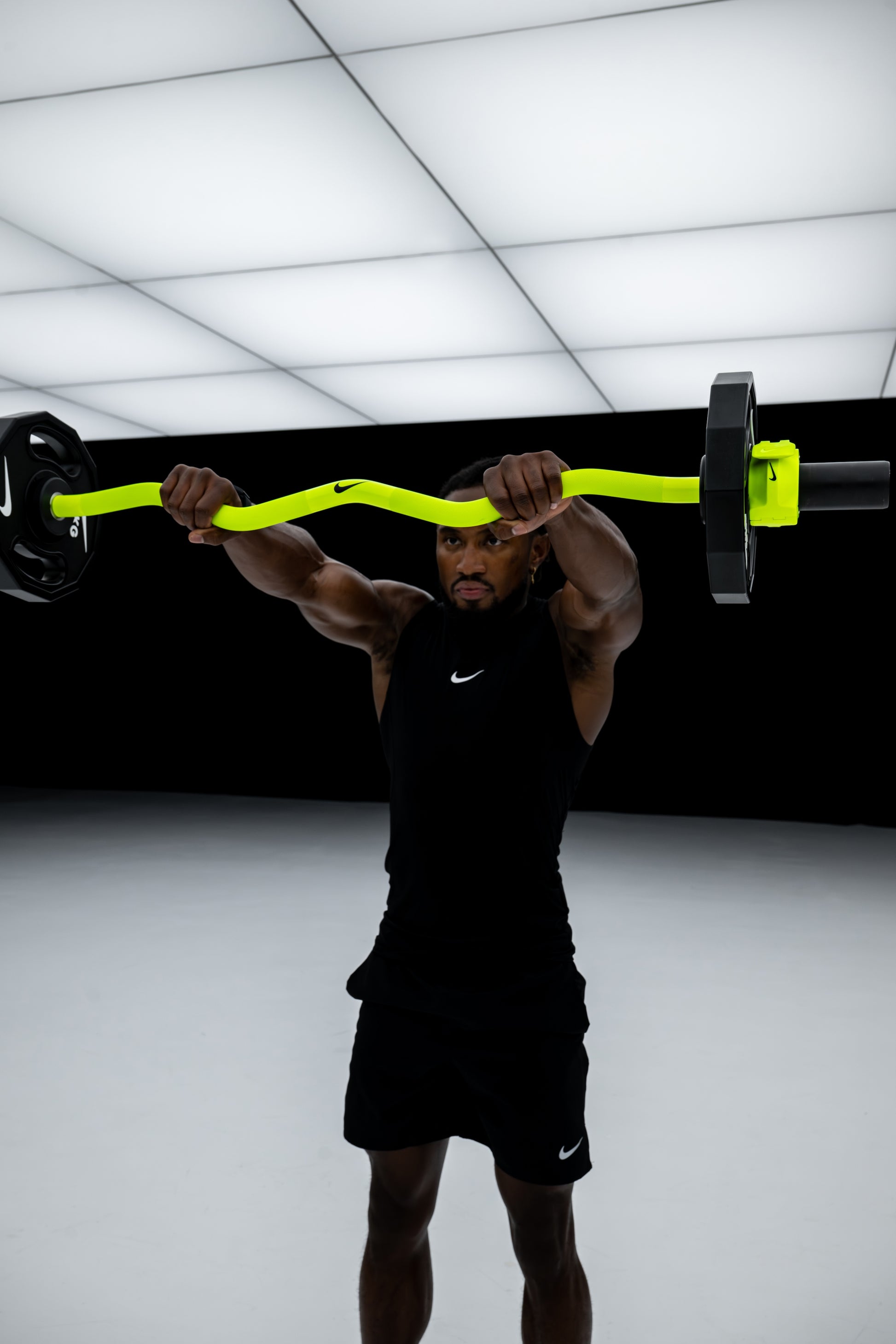Nike Strength Shield Curl Bar - Volt Swoosh / Nike Strength Pro Urethane Plates (1.25 - 5 kg pairs) / White/Orange